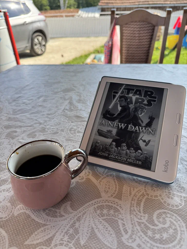 Reading on my kobo, and a cup of coffee.
